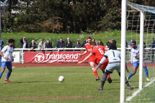 Enfields Karl Oliyide (R) cuts the ball back to Dernell Wynter who was unable to finish