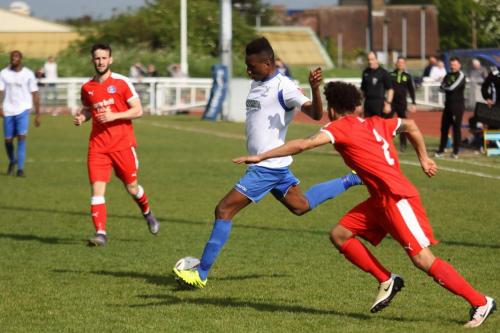 Enfields Karl Oliyide cuts inside Ollie Brown (R)