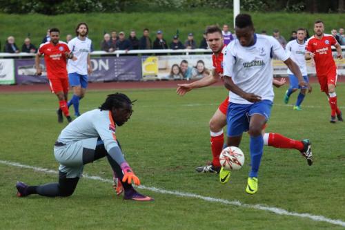 Enfields Karl Oliyide tries to go round Leiston keeper Ashlee Jones