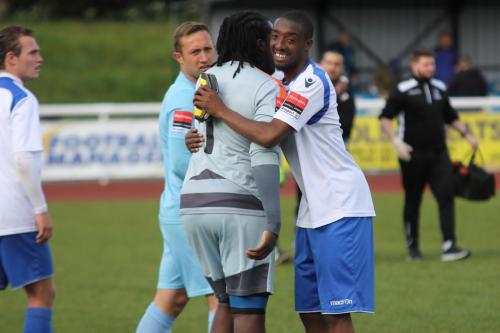 Enfields Ricky Gabriel (R) embraces Ashlee Jones at the end of the game