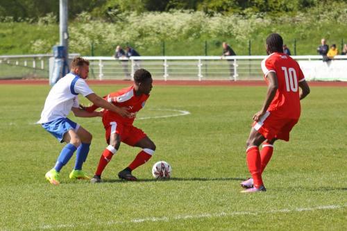 Enfields Scott Shulton (L) challenges Ade Cole