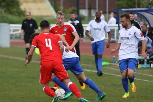 Enfields Scott Shulton (R) watches as Harry Ottaway tries to get past Jack Ainsley (4) and Armani Schaar