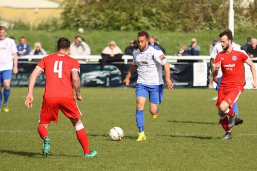 Enfields Scott Shulton and Leistons Jack Ainsley (4) and Joe Marsden