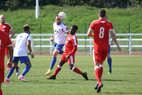 Enfields Scott Shulton beats Ade Cole to a header