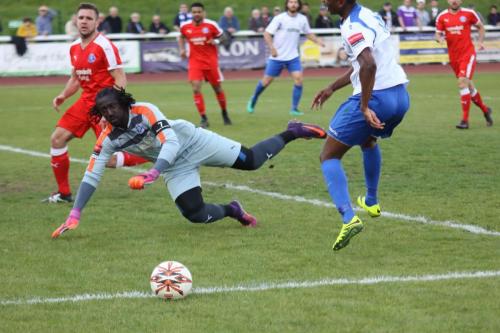Leiston keeper Ashlee Jones dives as Karl Oliyide plays an air shot at the crucial moment