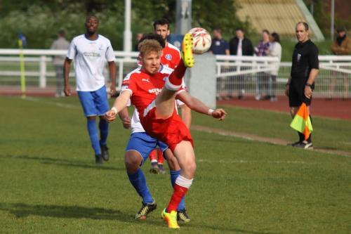 Leistons Conor Hubble hooks the ball clear
