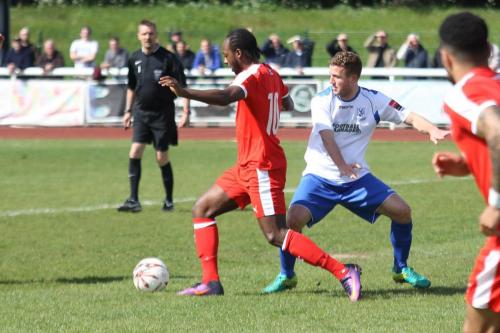 Leistons Niko Muir (L) and Enfields Billy Crook
