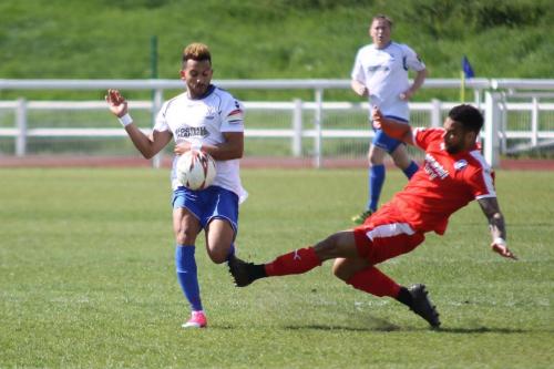 Leistons Seb Dunbar (R) tackles Tyler Campbell
