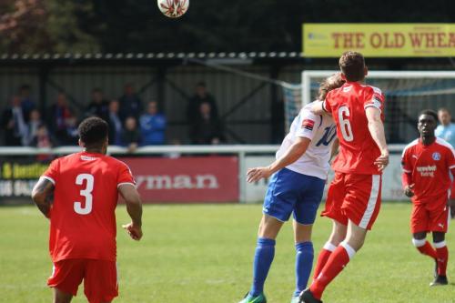 Leistons Tom Bullard (6) heads clear from Harry Ottaway