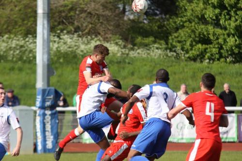 Leistons Tom Bullard (red, L) heads clear