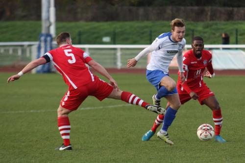 Enfields Mickey Parcell tries to get between Sonny Miles (L) and James Folkes