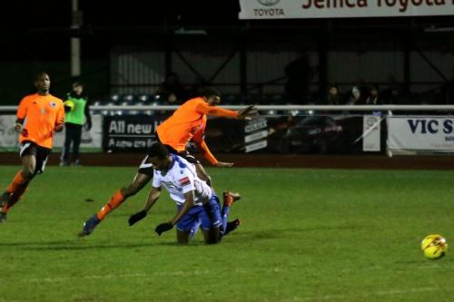 Bilericays Alex Stephenson (Orange, R) brings down Karl Oliyide to earn a red card for denying a clear goalscoring opportunity