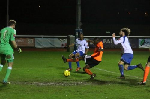 Billericays Abs Seymour (orange) tries to perevent the ball reaching Jonathan Muleba (white, L)