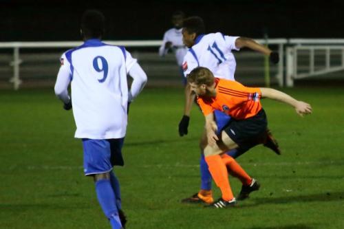 Billericays Danny Fitzsimons (orange)challenges Karl Oliyide