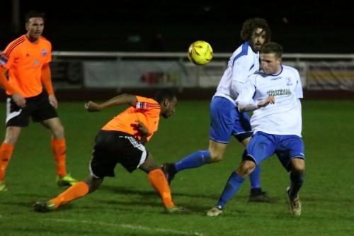 Billericays Ibrahim Diallo (orange, R) heads clear from Billy Crook (R) and Harry Ottaway