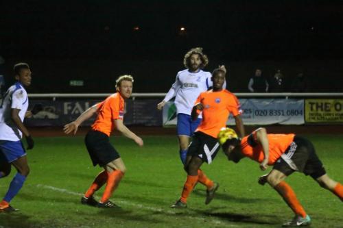 Billericays Rob Swaine (R) stoops to cut out a cross