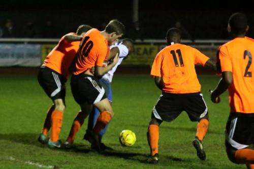 Enfields Harold Joseph is surrounded by Billericay defenders