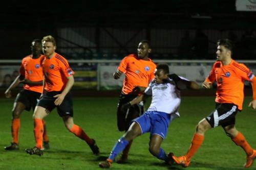 Enfields Karl Oliyide (white) sees his shot well saved