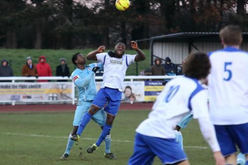 Enfields Harold Joseph (white) challenges Lartey Sarpong