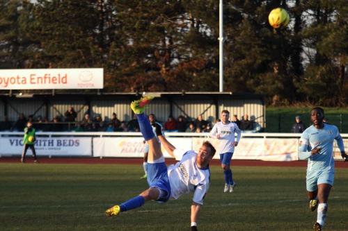 Enfields Scott Shulton sends an overhead kick just over the bar