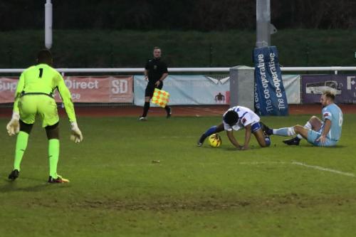 Grays Lewis Wilson (R) brings down Dernell Wynter to concede a penalty