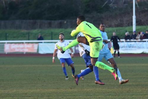 Grays keeper Amadou Tangara clears from Bobby Devyne
