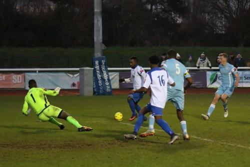 Grays keeper Amadou looks to have gone to ground too early but Bobby Devyne scuffs his shot straight at him