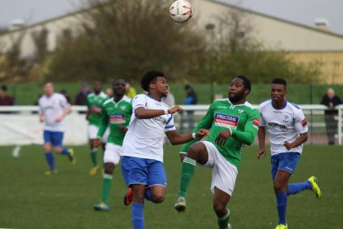 Enfields Dernell Wynter (L) challenges Jerry Nnamani