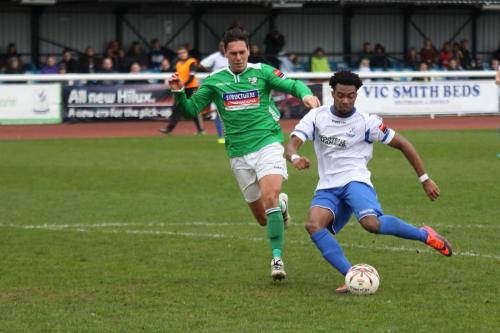 Enfields Dernell Wynter shoots watched by Joe Howe