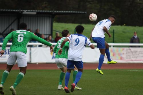 Enfields Karl Oliyide (R) flicks the ball on