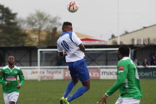 Enfields Karl Oliyide heads the ball forward