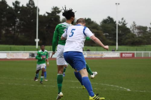 Enfields Mark Kirby (5) challenges Yannis Ambroisine