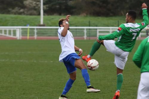 Enfields Tyler Campbell (L) and Leatherheads Jerome Federico