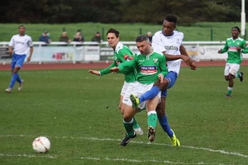 Leatherheads Danny Murphy makes it hard for Karl Oliyide (R) to get a clean shot away