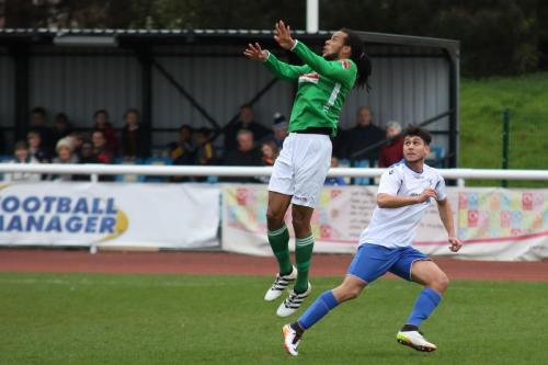 Leatherheads Yannis Ambroisine (L) goes for a header as Samir Bihmoutine gambles on him missing