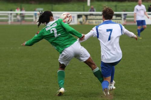 Leatherheads Yannis Ambroisine (L) is penalised for a late challenge on Mickey Parcell