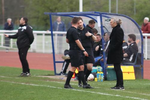 The match official deal with some dissent from the Leatherhead bench following the second Enfield goal