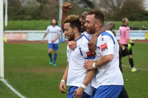 Tyler Campbell (L) celebrates the winning goal with Harold Joseph and Scott Shulton (R)