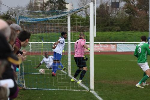 Tyler Campbells shot finds the net for Enfields winning goal  Dernell Wynter makes sure he cant be given offside