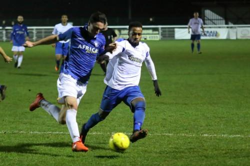 Lowestofts Travis Cole (L) and Enfields Bobby Devyne