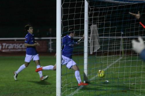 Travis Cole is too late to reach the ball before it crosses the line for Enfields first goal