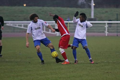 Enfields Harry Ottaway (L) and Bobby Devyne and Mersthams Kershaney Samuels