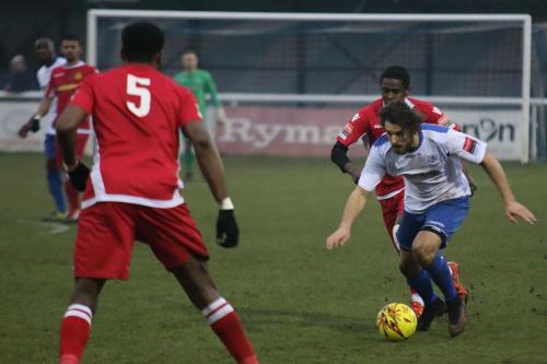Enfields Harry Ottaway (white) chased by Kershaney Samuels
