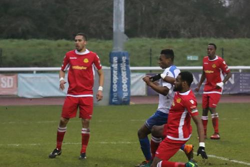 Enfields Karl Oliyide (white) gets ahead of Marc Okoye to make the score 2-2