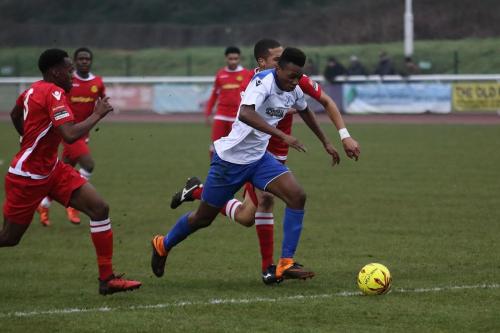 Enfields Karl Oliyide breaks into the box chased by Kristian Campbell (L) and Tutu Henriques