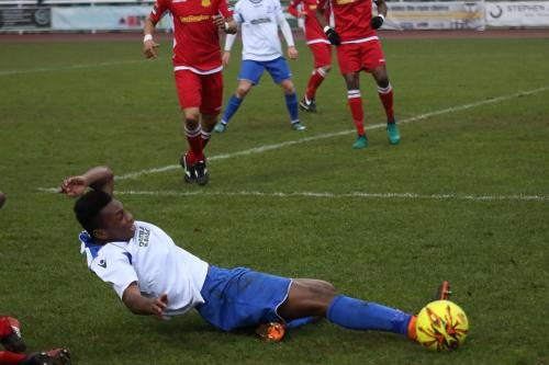 Enfields Karl Oliyide is brought down by Kristian Campbell to earn a penalty