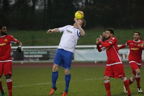 Enfields Mark Kirby flicks the ball on at a set piece