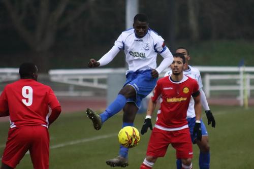 Enfields Percy Kiangebeni heads the ball straight downwards
