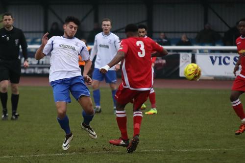 Enfields Samir Bihmoutine (L) and Mersthams Kristian Campbell