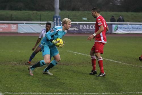 Merstham keeper Josh Smith makes a safe catch